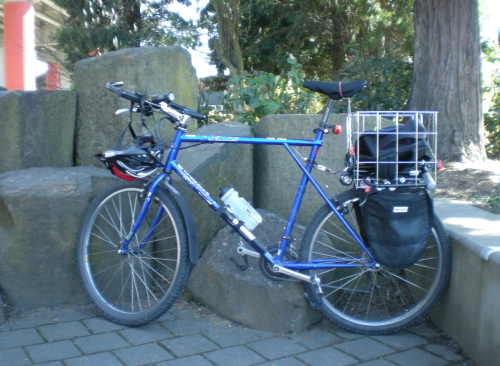 Dave Myers gives his beat-up bicycle a breather.